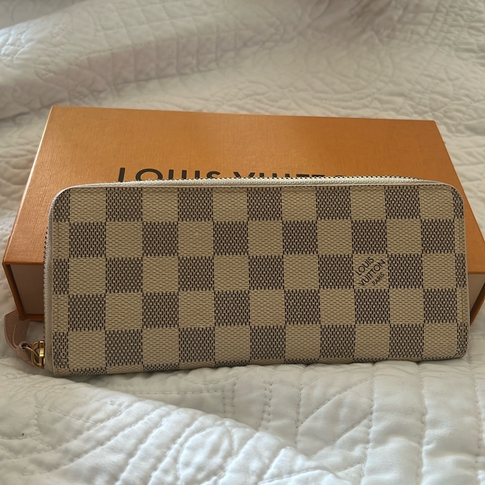 Damier Azur canvas gives a fresh look to Louis Vuitton's iconic Zippy wallet